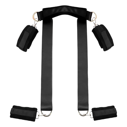 Bed restraints with positioning strap, blindfold, and feather riding crop