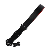 Playful riding crop with bone charm