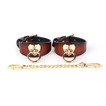 Heart-shaped handcuffs and leash