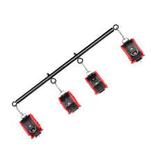 Adjustable spreader bar and handcuffs