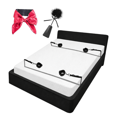 Bed Restraint with blindfold and feather riding crop